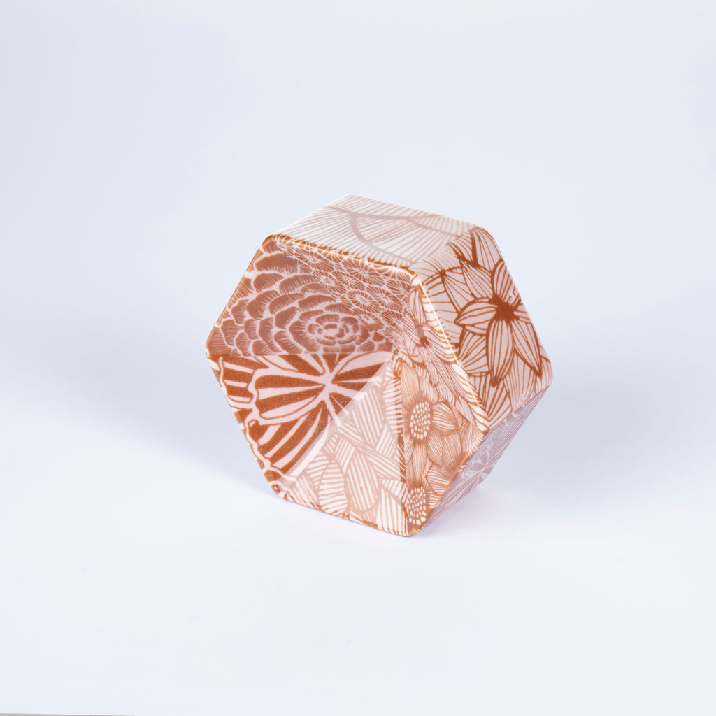 Hexagonal ceramic dish with floral pattern on a white background
